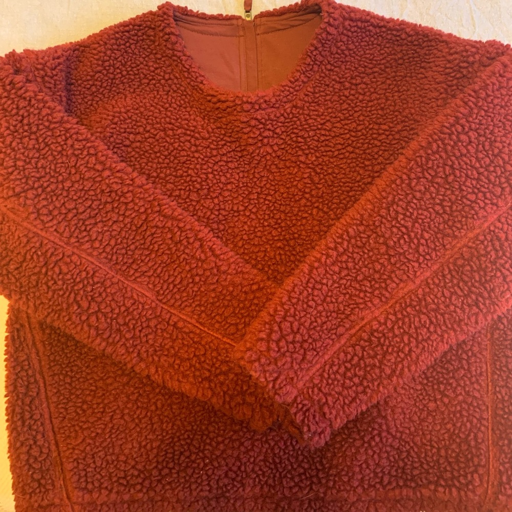 Beautiful burgundy lulu Sherpa sweater, not red as it appears in photo.